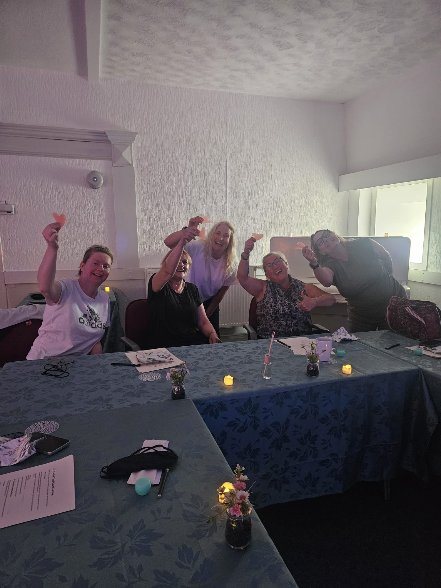 Group smiling during a Foxtail Fitness Gua Sha workshop